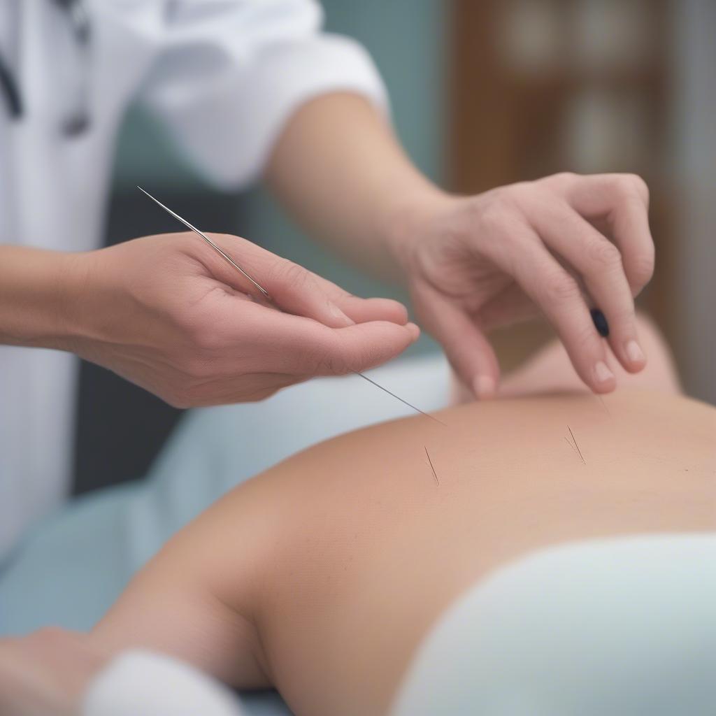 Experienced acupuncturist treating a patient